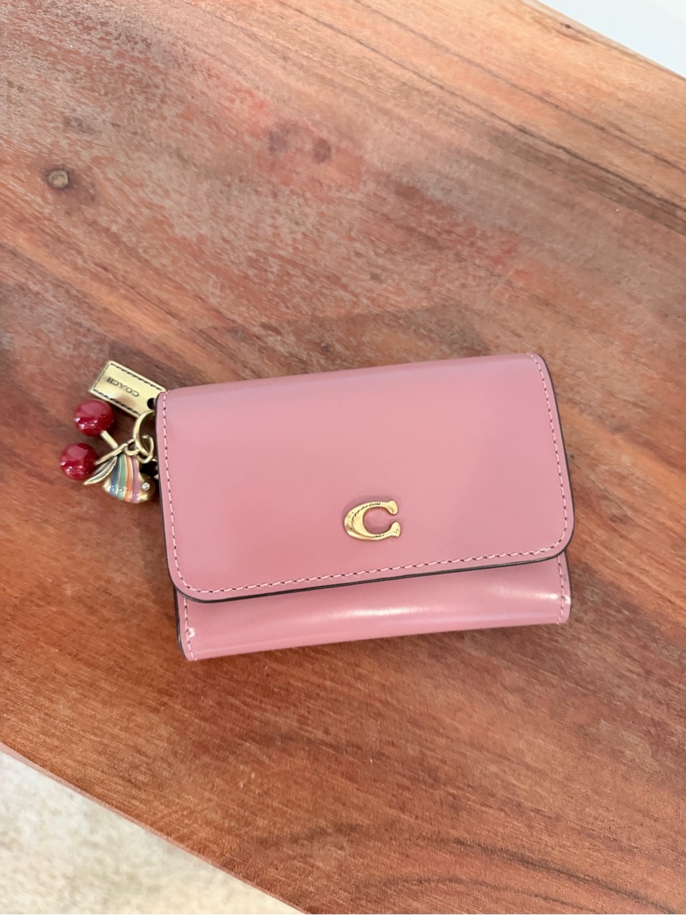 Coach Pink Leather Compact Wallet with Gold 'C' and Charm
